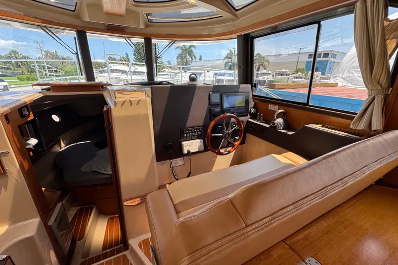 Slide: The Image of Interior of 2019 Ranger Tugs R-29 CB boat with helm, seating, and cabin view. - 25