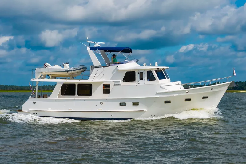 The Image of 2016 DeFever Euro 52 on the water with a blue sky. - 0