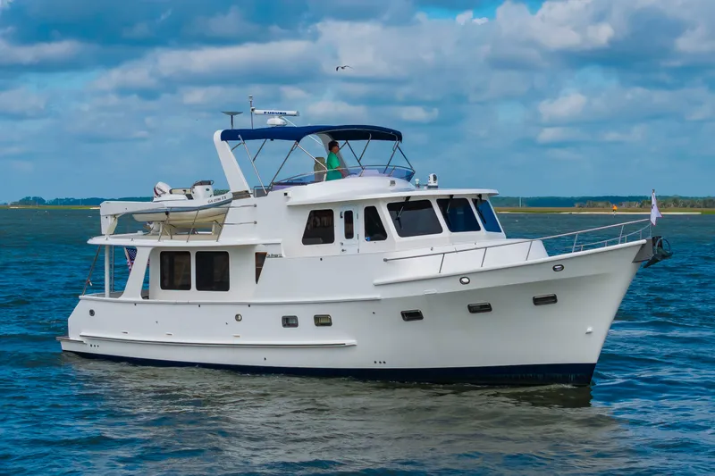 Slide: The Image of 2016 DeFever Euro 52 on the water with a blue sky. - 10