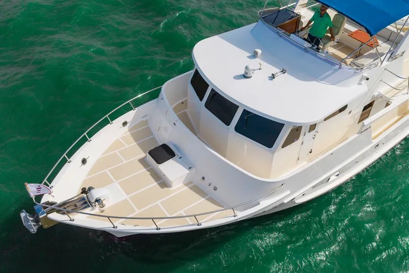 Slide: The Image of 2016 DeFever Euro 52 on the water with spacious deck and flybridge. - 14