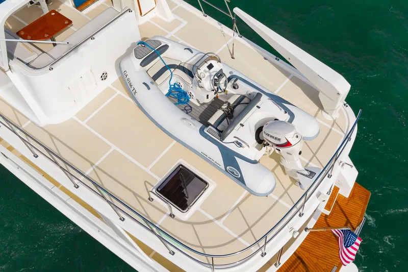 Slide: The Image of A 2016 DeFever Euro 52 with a dinghy on the deck. - 15