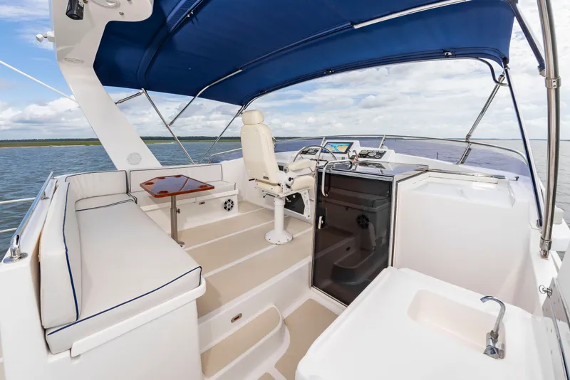 Slide: The Image of The image shows the cockpit of a 2016 DeFever Euro 52 with a blue canopy. - 16