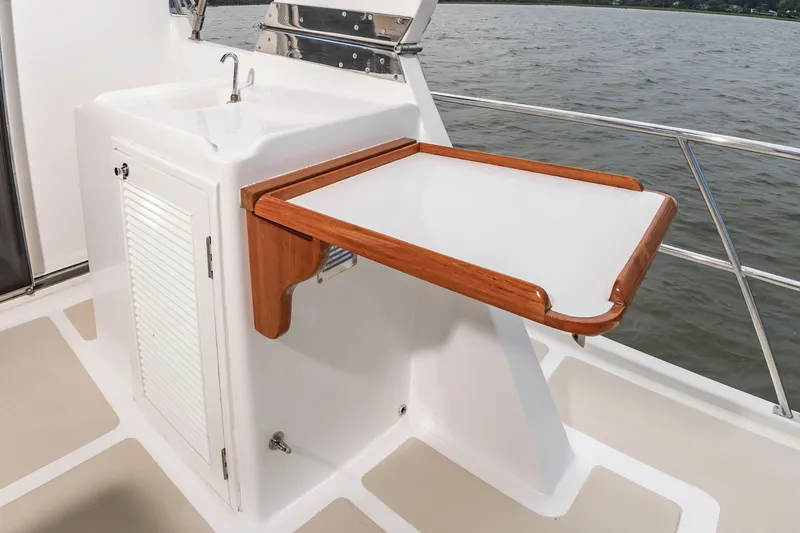 Slide: The Image of 2016 DeFever Euro 52 with a foldable table and sink on the deck. - 24