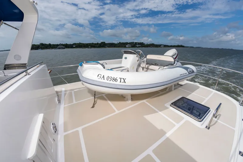 Slide: The Image of A dinghy on the deck of a 2016 DeFever Euro 52 yacht. - 26