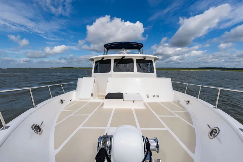 Slide: The Image of 2016 DeFever Euro 52 on calm water under a blue sky. - 29