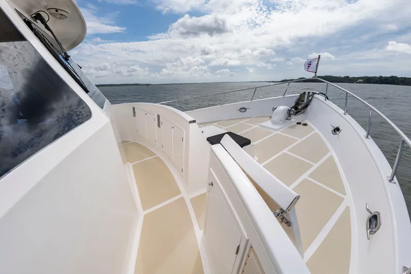 Slide: The Image of 2016 DeFever Euro 52 on calm water with spacious deck and clear view. - 30