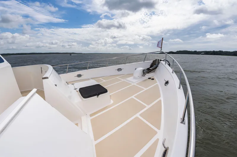 Slide: The Image of 2016 DeFever Euro 52 on calm water with spacious deck and clear view. - 31