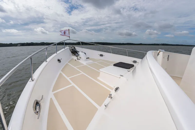 Slide: The Image of 2016 DeFever Euro 52 on calm water with a cloudy sky. - 33