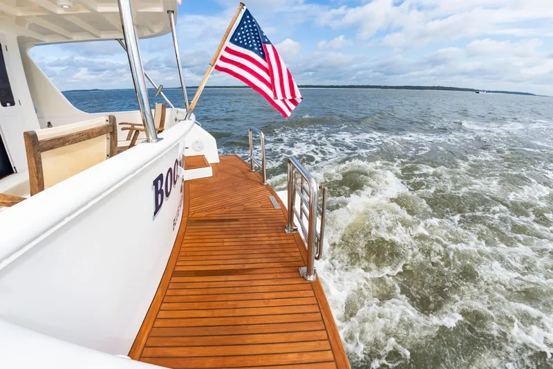 Slide: The Image of DeFever Euro 52 from 2016 on the water with an American flag. - 37