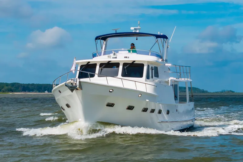 Slide: The Image of A 2016 DeFever Euro 52 yacht cruising on the water. - 4