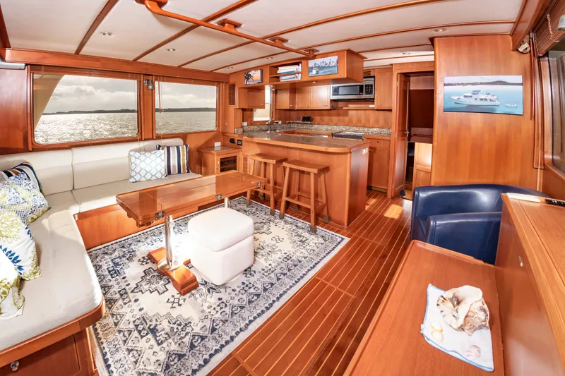 Slide: The Image of Interior of a DeFever Euro 52 yacht with wooden floors and elegant furnishings. - 40