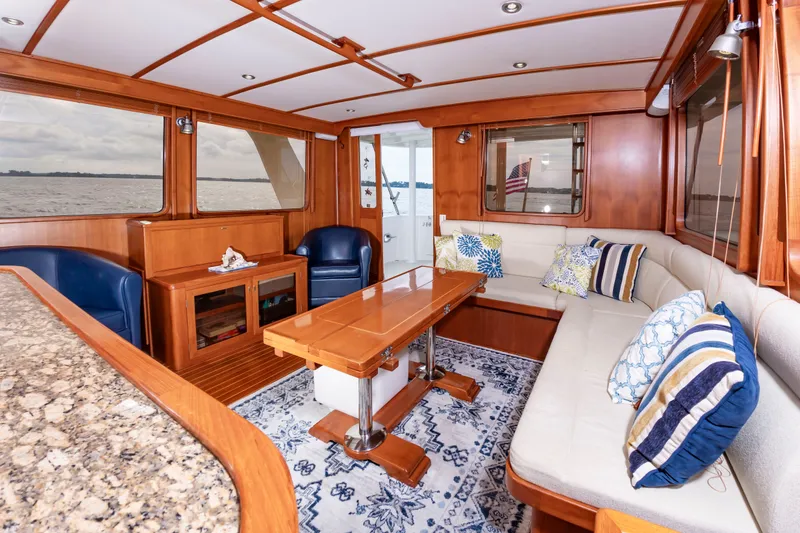 Slide: The Image of Interior of a DeFever Euro 52 yacht with elegant wood finishes and cozy seating. - 42