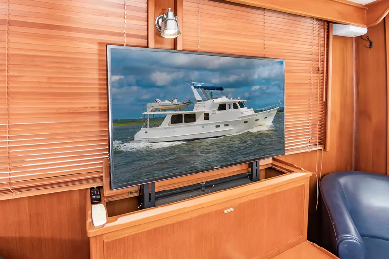 Slide: The Image of A 2016 DeFever Euro 52 displayed on a TV in a wood-paneled room. - 43