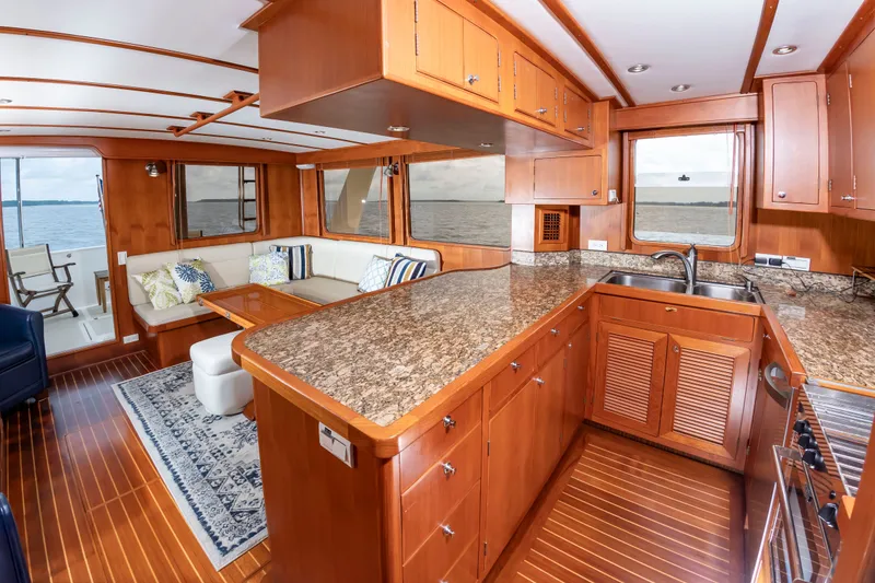 Slide: The Image of Interior of a DeFever Euro 52 yacht with wooden furnishings and granite surfaces. - 45