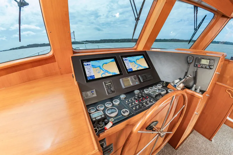 Slide: The Image of Helm of the 2016 DeFever Euro 52 with modern navigation systems. - 48