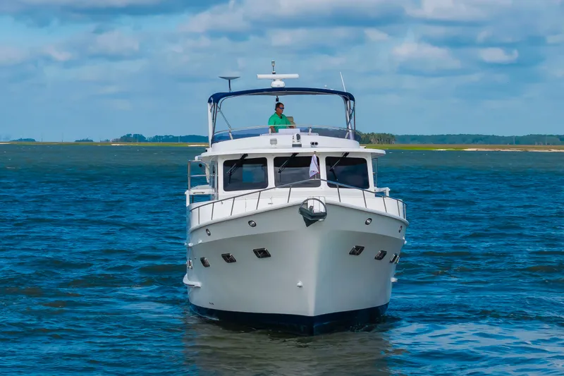 Slide: The Image of 2016 DeFever Euro 52 on the water with a blue sky. - 9