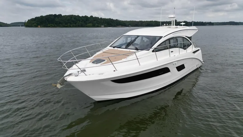Slide: The Image of 2017 Sea Ray Sundancer 400 yacht on calm water, overcast sky. - 2