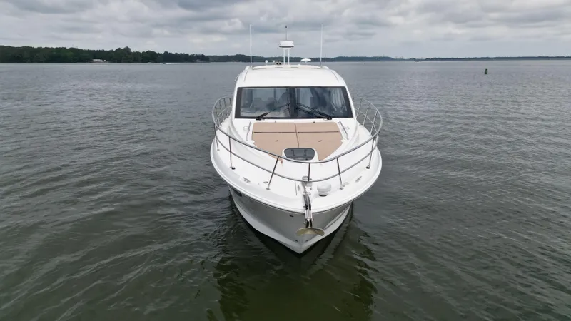 Slide: The Image of 2017 Sea Ray Sundancer 400 yacht on calm water under cloudy sky. - 4