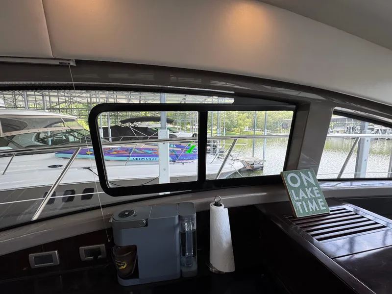 Slide: The Image of Interior view of 2017 Sea Ray Sundancer 400 yacht with lake scenery outside. - 43