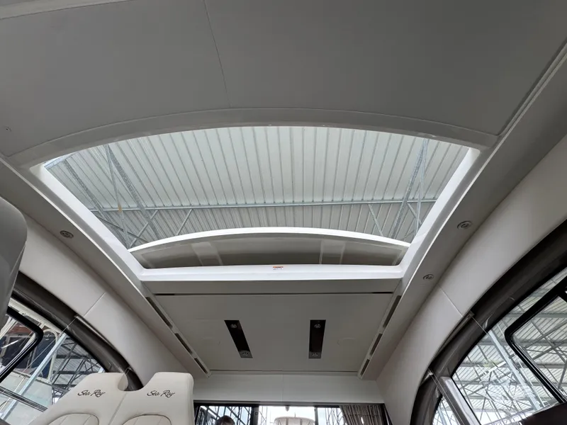 Slide: The Image of 2017 Sea Ray Sundancer 400 interior with sunroof and luxurious seating. - 48