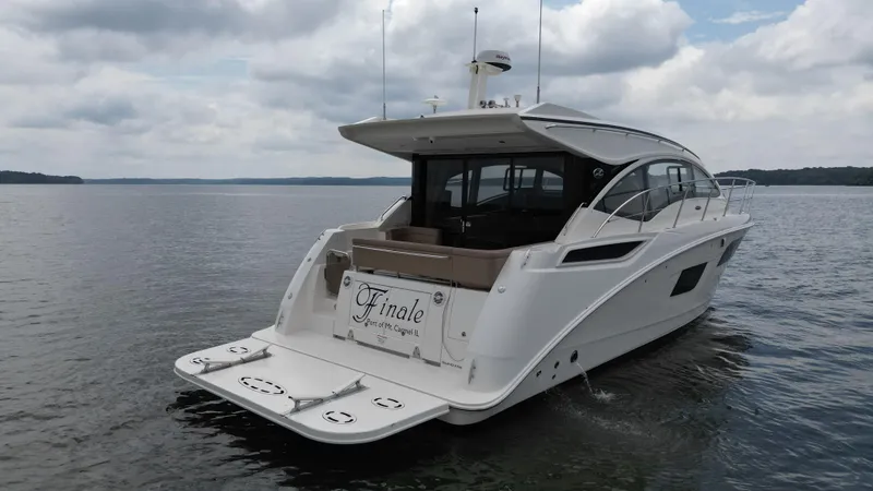 Slide: The Image of 2017 Sea Ray Sundancer 400 yacht on calm waters under cloudy skies. - 8
