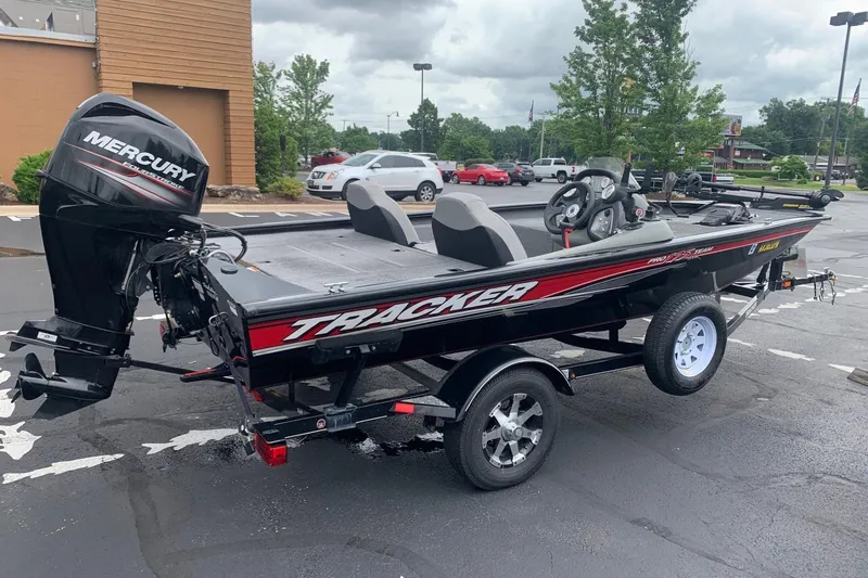 Slide: The Image of 2016 Tracker Pro Team 175 TXW boat with Mercury engine in parking lot. - 3