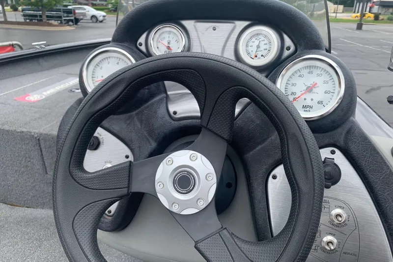 Slide: The Image of Steering wheel and dashboard of 2016 Tracker Pro Team 175 TXW boat. - 4