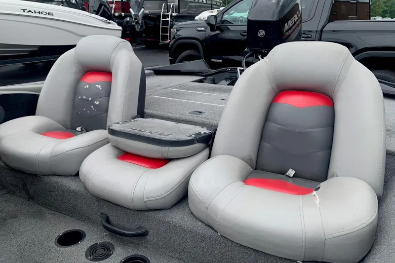 Slide: The Image of 2016 Tracker Pro Team 175 TXW boat seats with red and gray upholstery. - 9