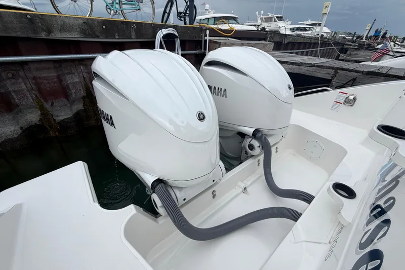 Slide: The Image of 2024 Pursuit S 328 Sport boat with dual Yamaha outboard engines at dock. - 18