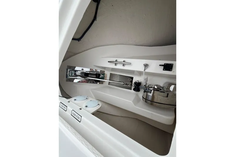 Slide: The Image of Interior view of 2024 Pursuit S 328 Sport boat, showcasing sleek design and equipment. - 26