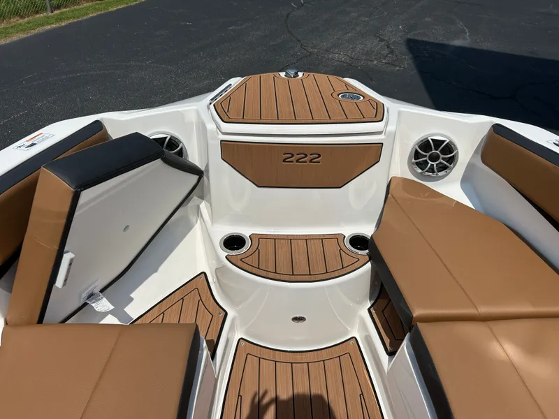 Slide: The Image of The image shows the bow of a Yamaha 222SE boat with brown upholstery and speakers. - 21