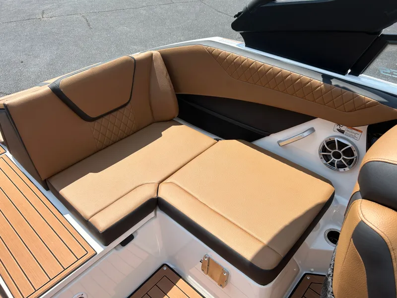 Slide: The Image of The 2026 Yamaha 222SE features luxurious brown upholstery with elegant stitching and a speaker. - 22
