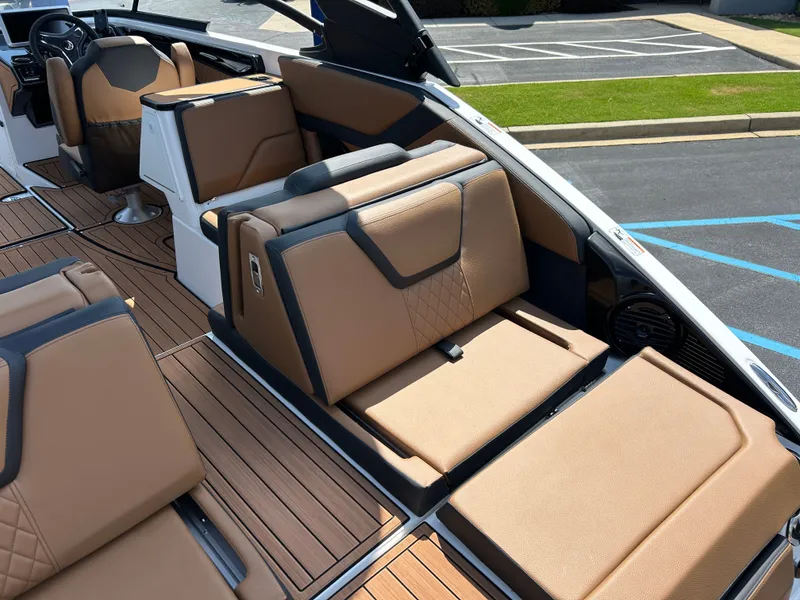 Slide: The Image of The image shows the luxurious interior of a Yamaha 252SD boat with sleek, brown seating. - 7
