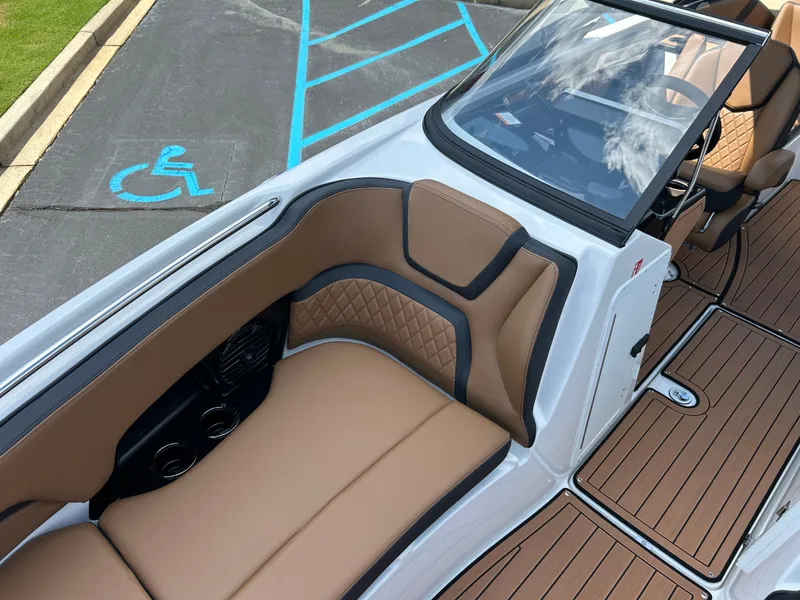Slide: The Image of The image shows the cockpit of a 2026 Yamaha 252SD boat with sleek seating. - 21