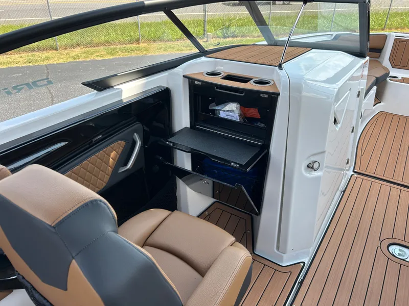 Slide: The Image of The image shows the cockpit of a Yamaha 252SD boat with modern seating and built-in storage. - 18