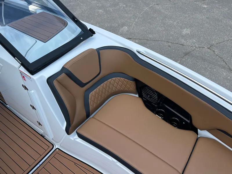 Slide: The Image of The image shows the interior of a Yamaha 252SD boat with brown upholstery and wood flooring. - 22