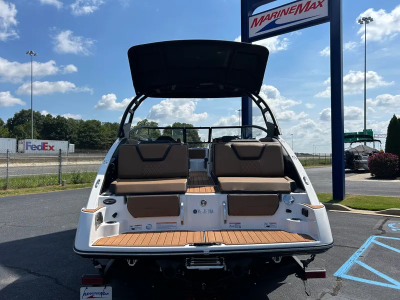 Slide: The Image of The image shows a 2026 Yamaha 252SD boat with brown seats and a black canopy. - 2