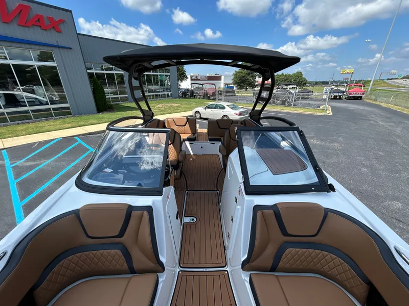 Slide: The Image of The image shows the cockpit of a 2026 Yamaha 252SD boat with brown seating. - 23