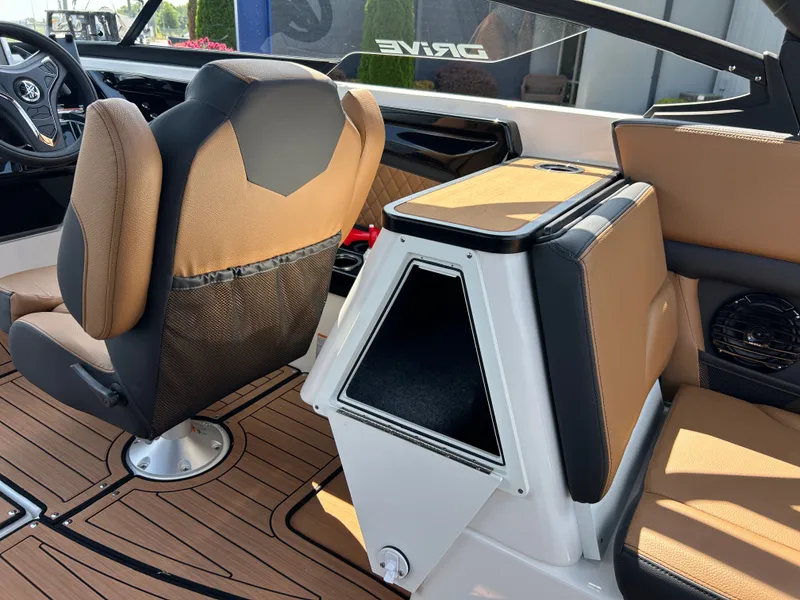 Slide: The Image of Interior of a modern boat with brown seats and a black dashboard. - 12