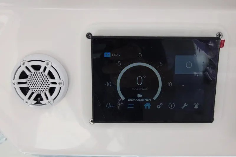 Slide: The Image of A control panel with a speaker and digital display on a boat. - 13