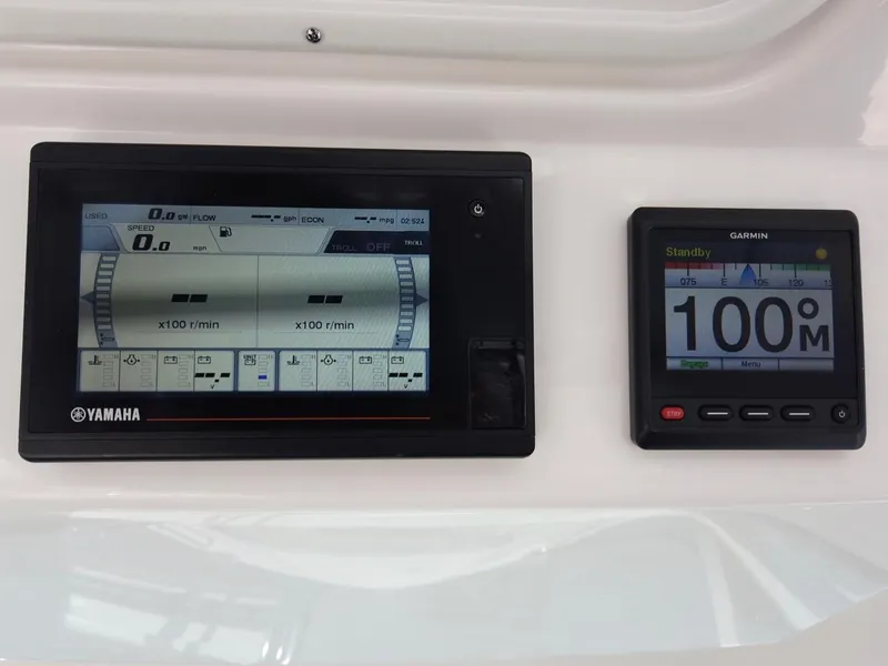Slide: The Image of Yamaha and Garmin displays on a boat, showing speed and other metrics. - 14
