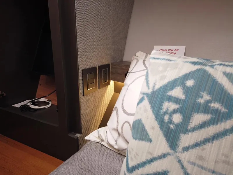 Slide: The Image of Interior of a boat with modern cushions and electrical outlets. - 20