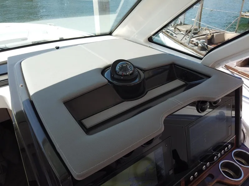 Slide: The Image of The image shows the dashboard of a 2024 Tiara Sport 34LS with a compass. - 24