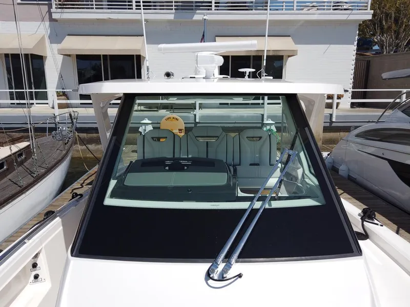Slide: The Image of The 2024 Tiara Sport 34LS is docked. It features a sleek design with clean lines. - 27