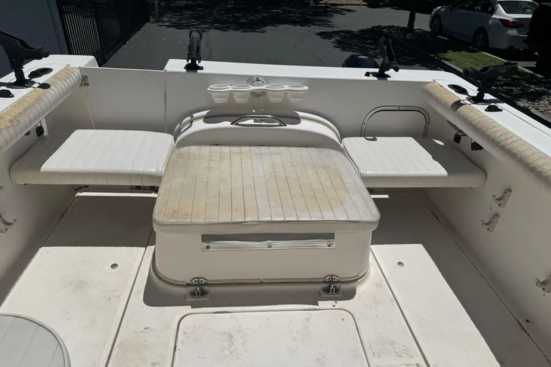 Slide: The Image of 2004 Trophy 2359 WA boat interior with seating and rod holders. - 11