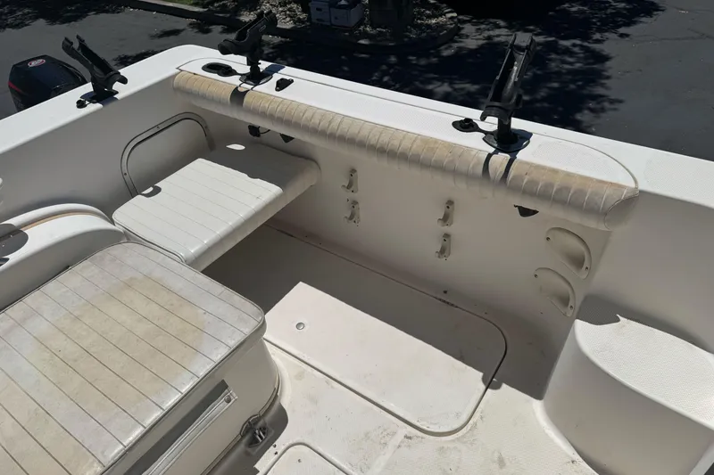 Slide: The Image of 2004 Trophy 2359 WA boat interior with seating and rod holders. - 12