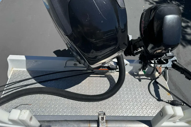 Slide: The Image of River Hawk 19 GB 2014 boat motor on metal platform, viewed from above. - 13