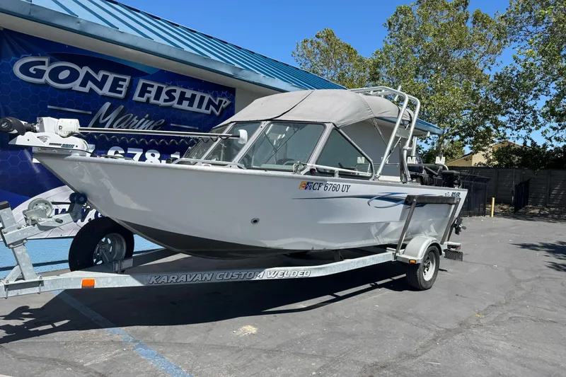 Slide: The Image of 2014 River Hawk 19 GB boat on trailer at Gone Fishin' Marine dealership. - 2