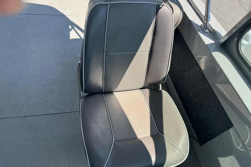 Slide: The Image of Black seat in a 2014 River Hawk 19 GB boat interior. - 21