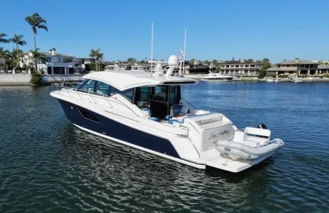 Slide: The Image of A 2017 Tiara Yachts C53 Coupe is anchored in the water. It features a sleek design. - 5